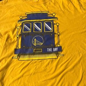 Golden State Warriors, yellow and blue T-shirt with a Trolley